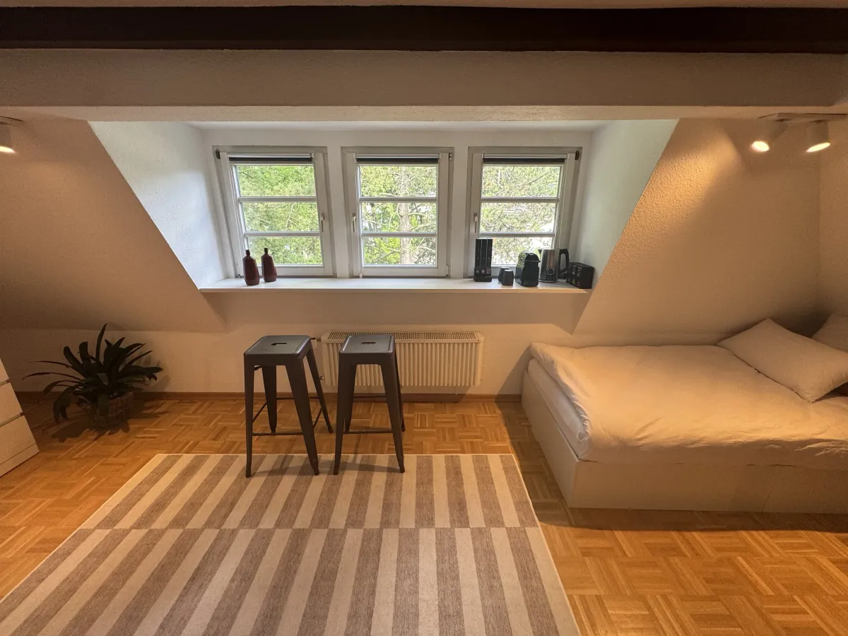 Bedroom with double bed and garden-view windows