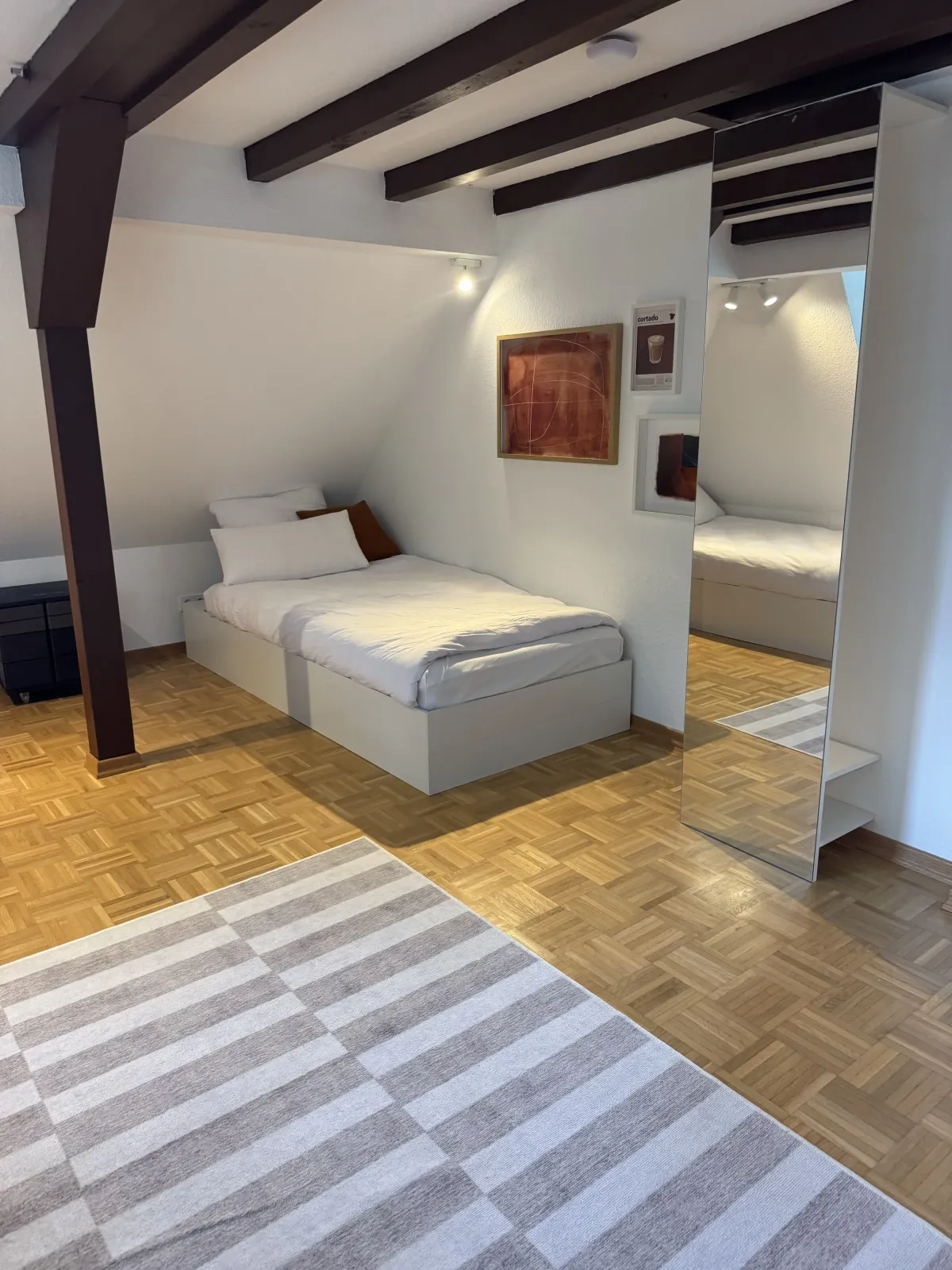 Single bedroom with full-length mirror