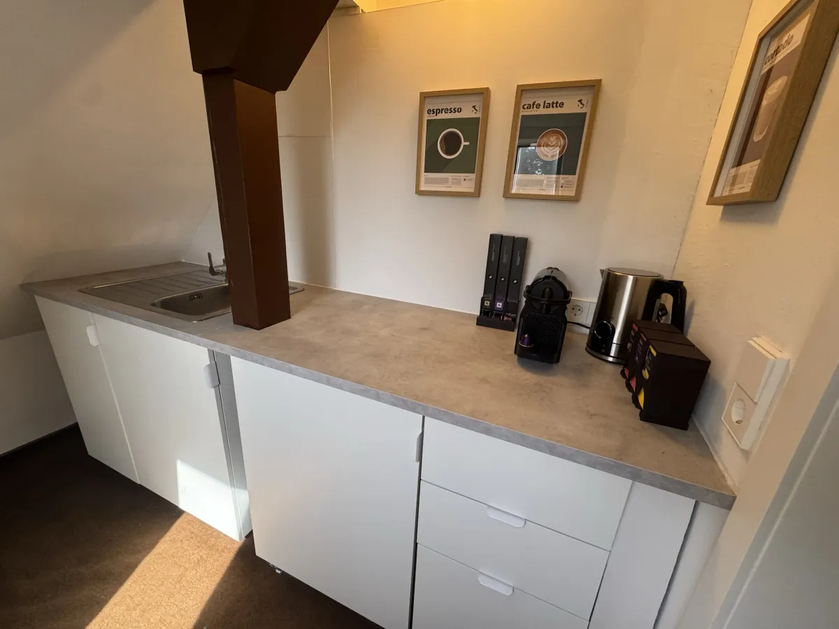 Kitchenette with espresso machine and kettle